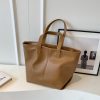 1741039788422729728.jpg Niche, High-end Commuting Retro Women's Tote Bag